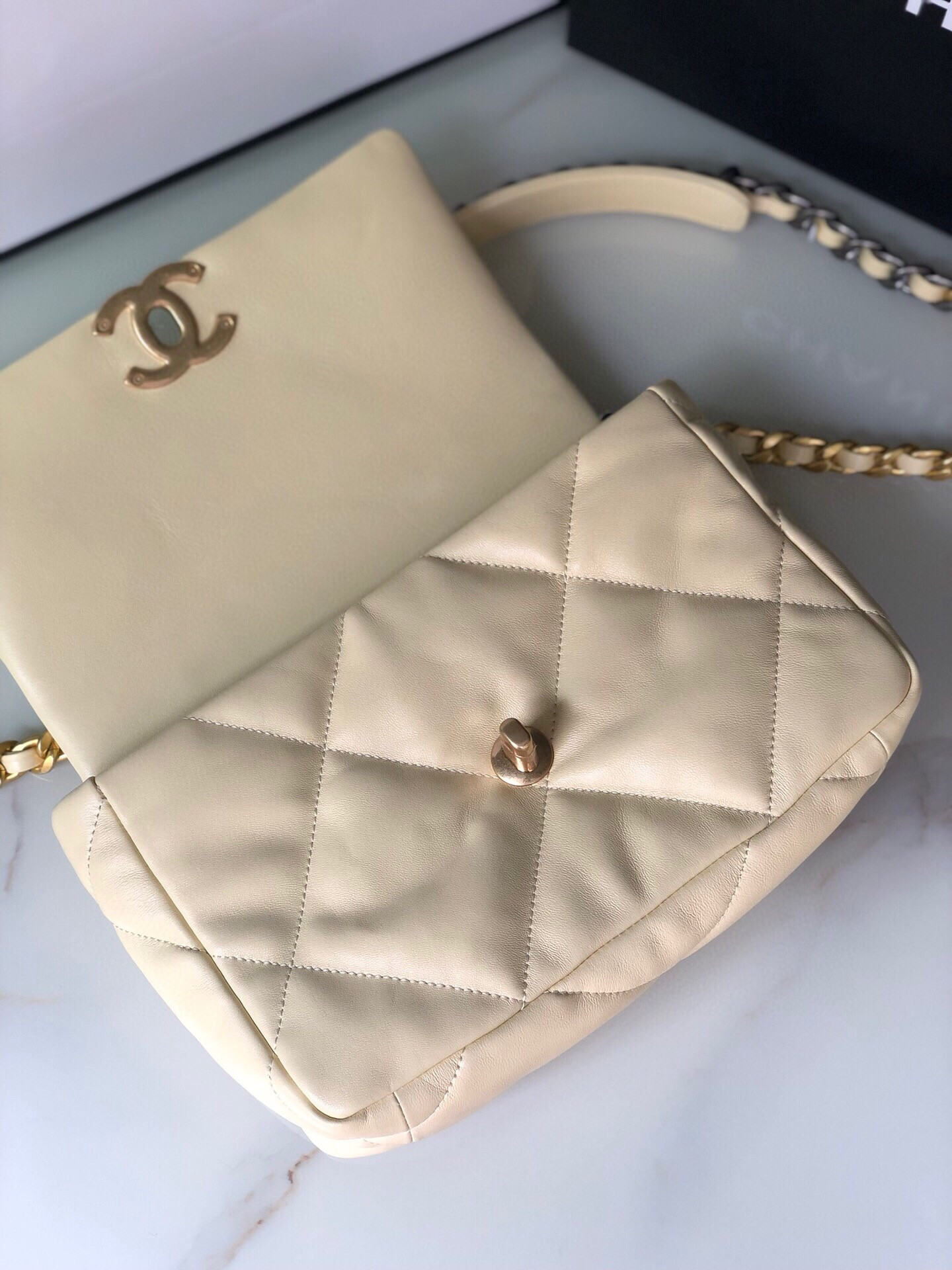 Ch*el 19 handbag shiny leather, gold-tone, silver-tone & ruthenium-finish metal dark yellow 6.2 × 10.1 × 3.5 in