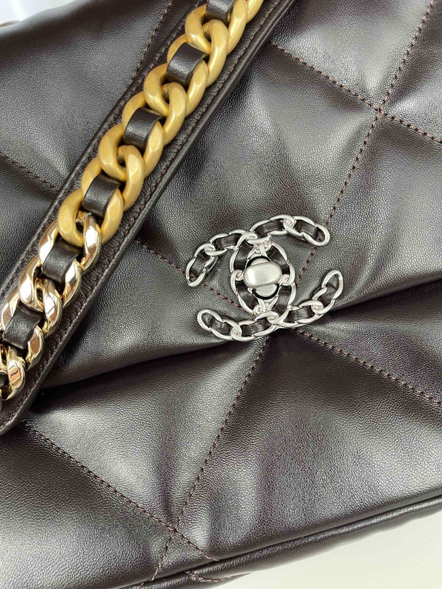 Ch*el 19 large handbag shiny leather black, gold-tone, silver-tone & ruthenium-finish metal 7.8 × 11.7 × 3.9 in