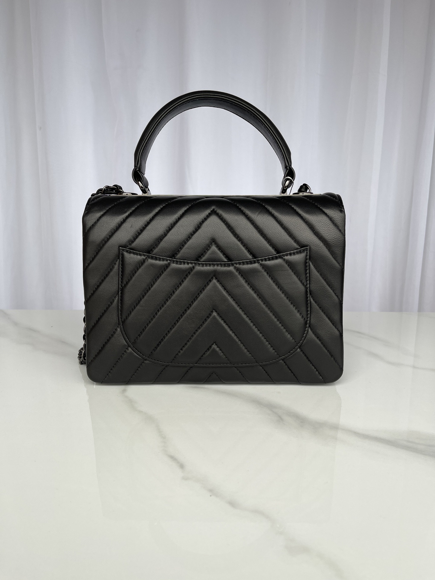 Ch*el flap bag with top handle 6.6 × 9.8 × 4.7 in